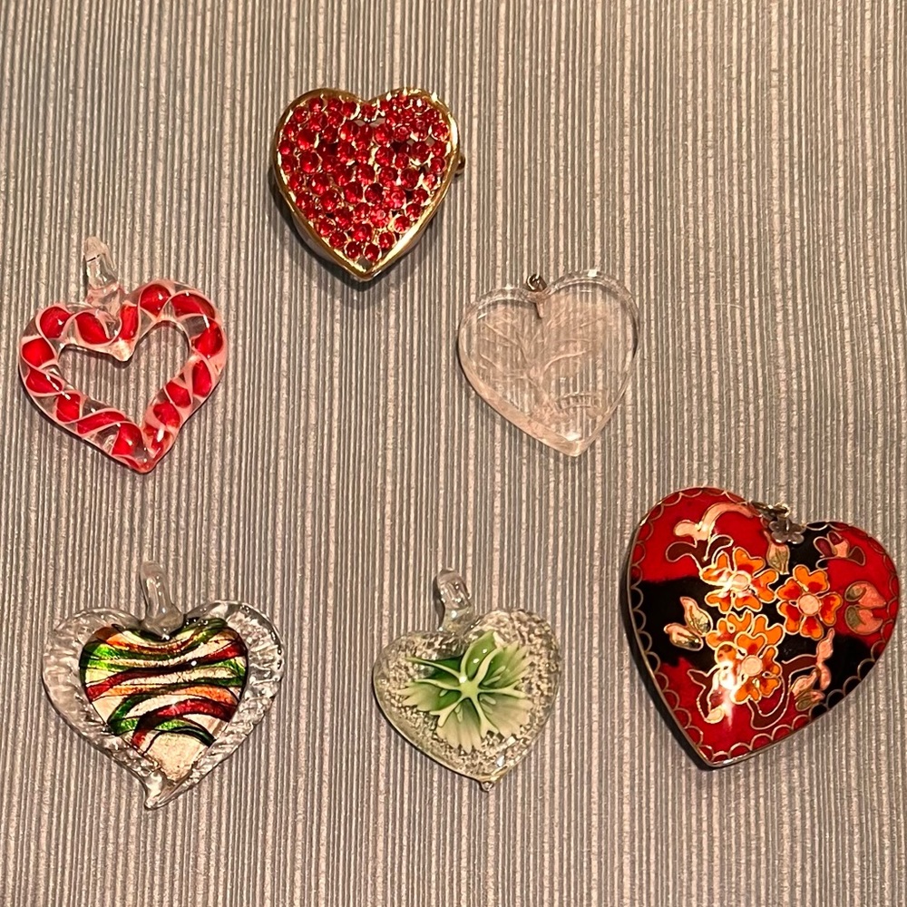 Lot of heart shaped pendants and 1 light up pin